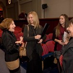 Attendees laugh and engage in conversation